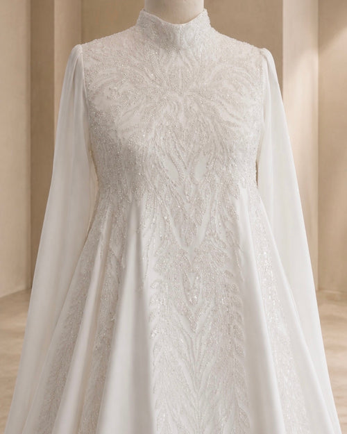 White lace dress on a mannequin against a neutral background